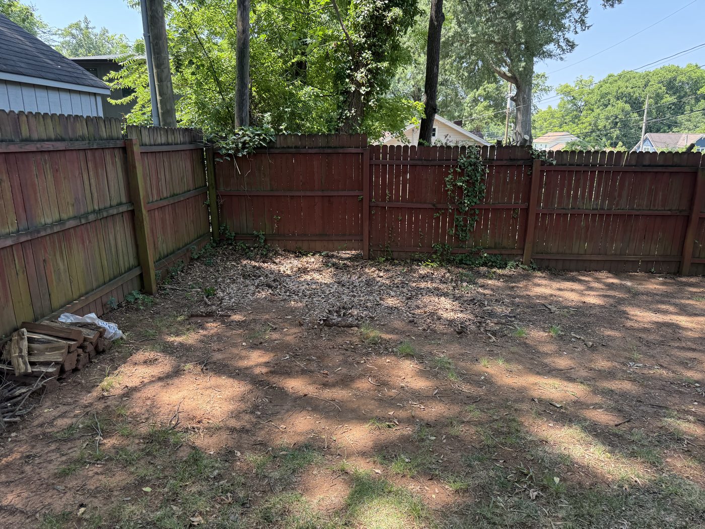 Backyard cleared after hauling and debris removal service Charlotte NC