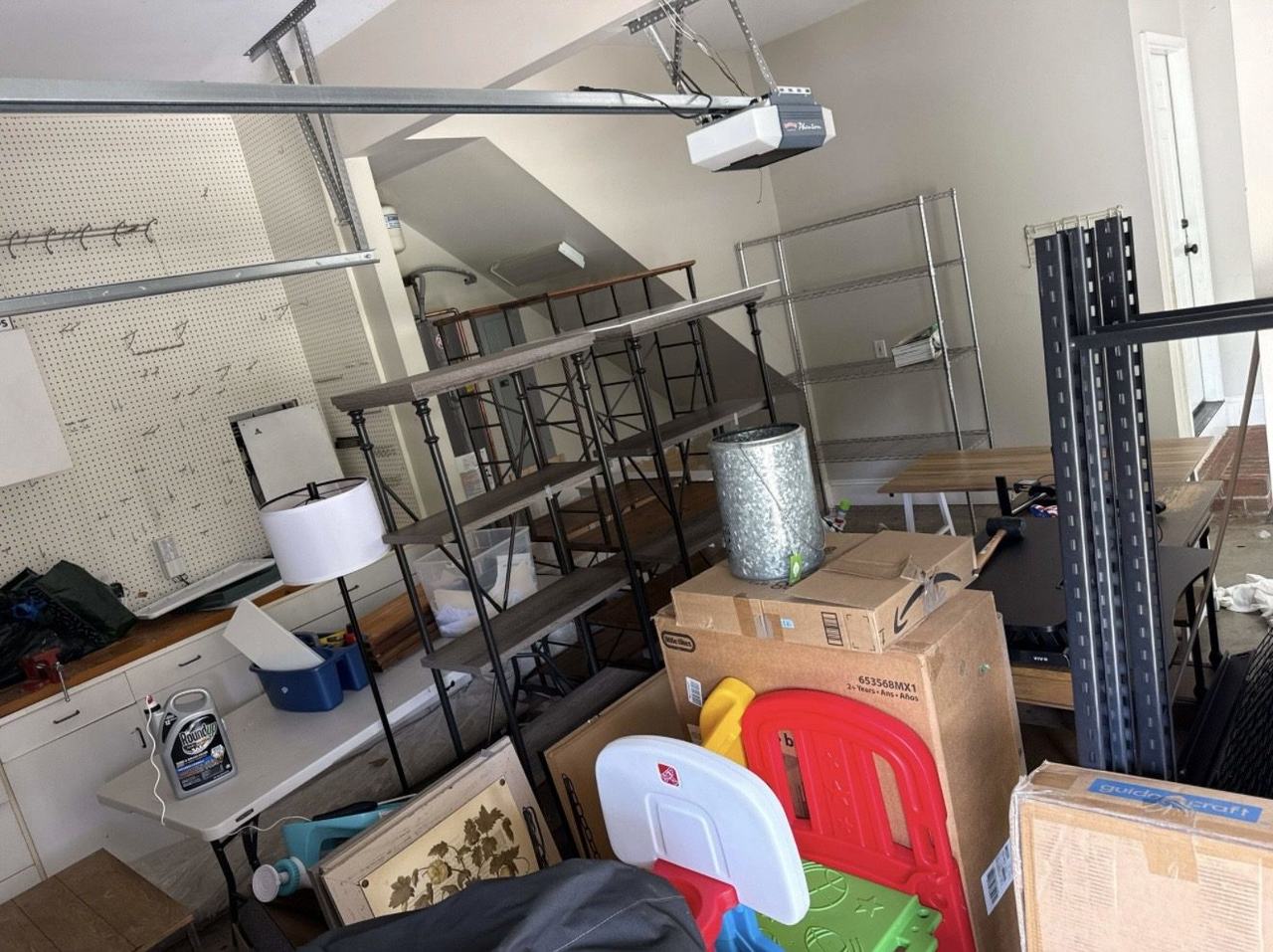 Garage packed with junk before removal in Charlotte NC