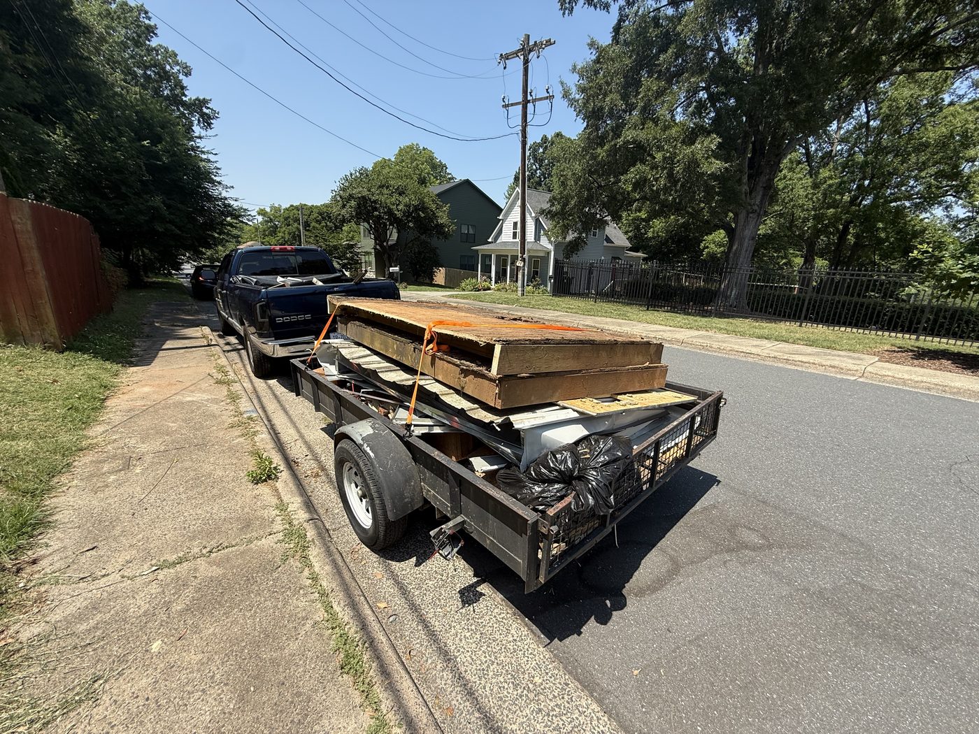 Mount N Muscle hauling service trailer loaded Charlotte NC debris removal