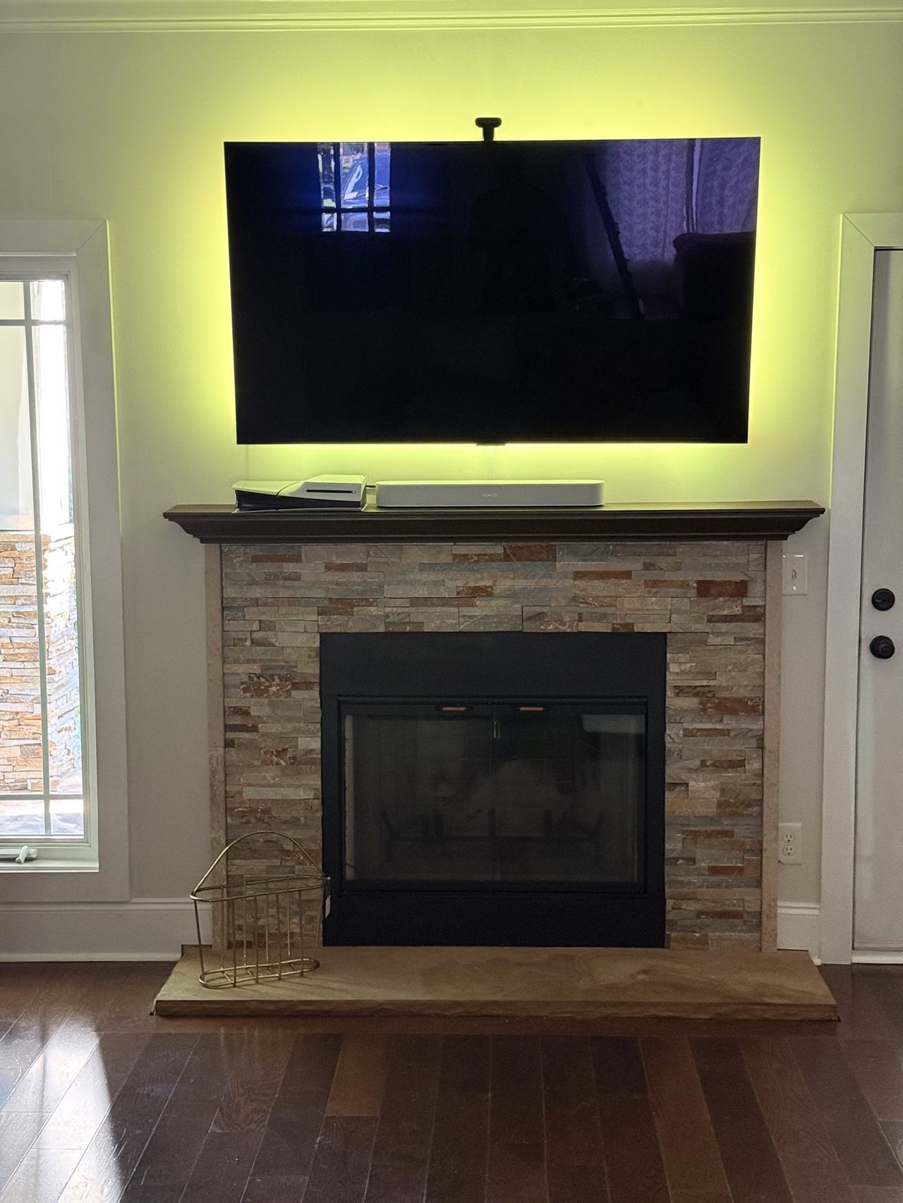 TV mounted above stone fireplace in Charlotte NC