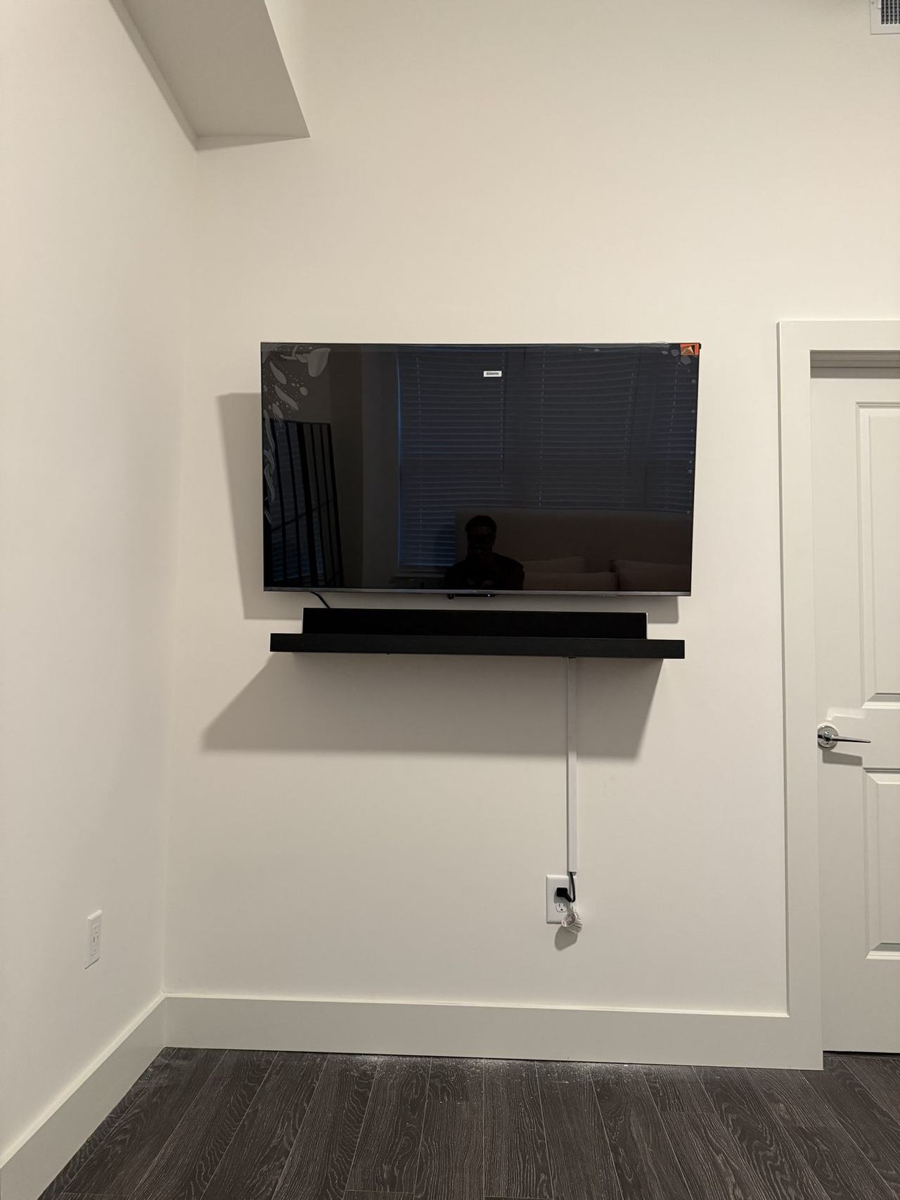 TV wall mounted with floating shelf in Charlotte NC